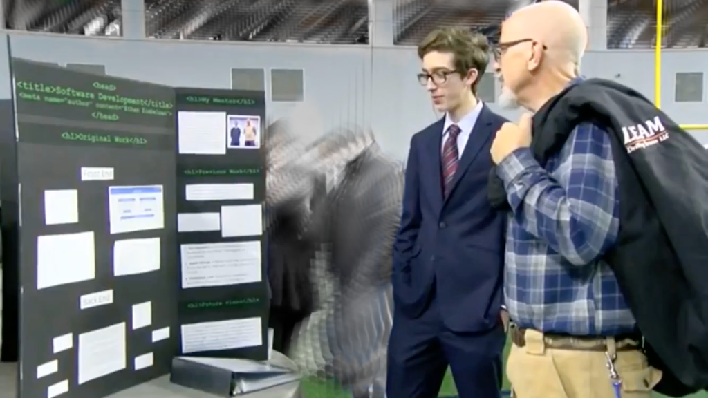 presenting a display board of my work from independent studies to my teacher